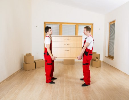 Packed moving boxes and furniture ready for transport