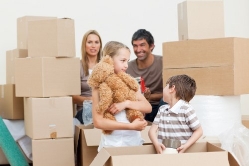 Packed moving boxes and furniture ready for transport in Enfieldwash